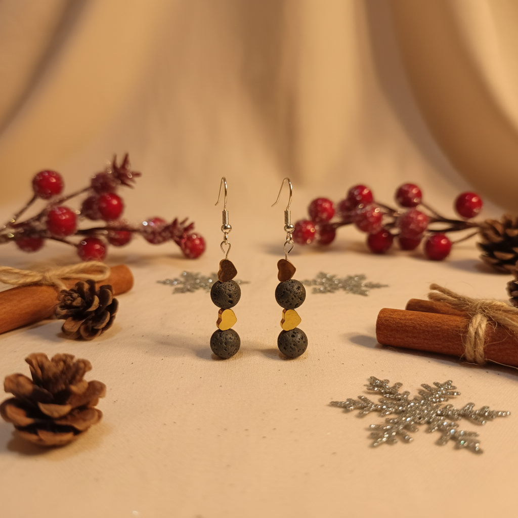 Handmade earrings featuring two gold-plated hearts and two natural Lava stones