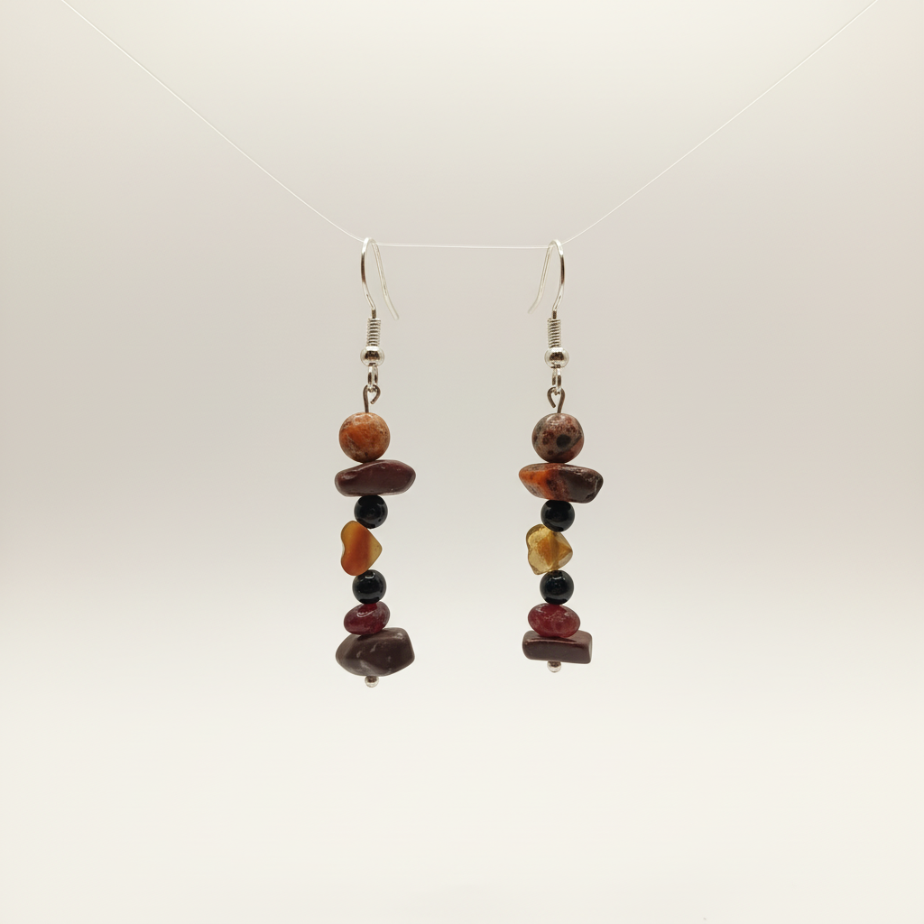 Handmade earrings featuring a gold-plated heart, a protective Bull’s Eye charm, and natural stones – Onyx, Garnet, and Jasper. 
