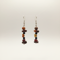 Handmade earrings featuring a gold-plated heart, a protective Bull’s Eye charm, and natural stones – Onyx, Garnet, and Jasper. 