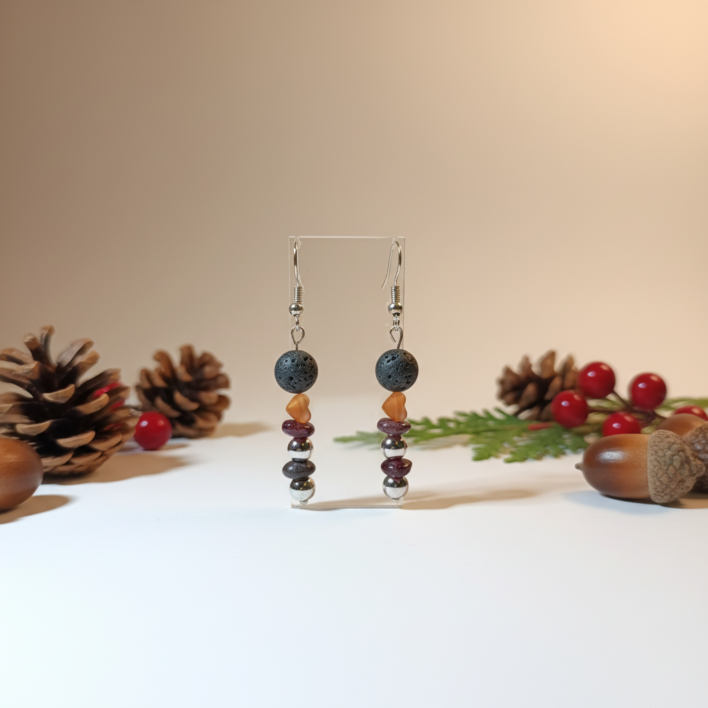 Delicate handmade earrings featuring a gold-plated heart, natural Lava stone, Garnet, and stainless steel beads. 