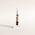 Handmade earrings featuring a gold-plated four-leaf clover, a protective Bull’s Eye charm, and natural stones – Garnet, Agate, Jasper, and Lava. 